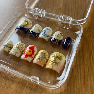 Sun and moon pattern fake nails, mysterious square fake nails, natural color mixed fake nails, beautiful fake nails