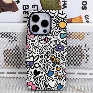 May include: A white phone case with a black border, decorated with a colourful doodle pattern. The design includes flowers, hearts, and abstract shapes in pink, yellow, blue, and black. The case has a camera cutout.