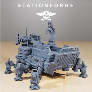 May include: A grey unpainted miniature model of a multi-legged mechanical transport vehicle with a rear cargo bed, a top-mounted turret with dual cannons, and a mechanical claw arm. The text STATIONFORGE and a skull logo appear above the vehicle.