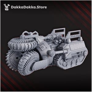 May include: A gray, detailed model of a futuristic vehicle with large, textured wheels and a complex mechanical design. The vehicle has a central cannon and various gears and panels. The text "DakkaDakka.Store" is visible in the upper left corner.