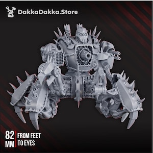 May include: A detailed, grey, mechanical war machine with spiked limbs and a central body featuring a circular design. The text "82 mm FROM FEET TO EYES" is visible. The DakkaDakka.Store logo is in the upper left corner.