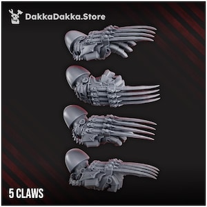 May include: Four gray, mechanical claw attachments, each with a helmet-like structure and multiple sharp blades. The text "5 CLAWS" is at the bottom. The top of the image has the text "DakkaDakka.Store".