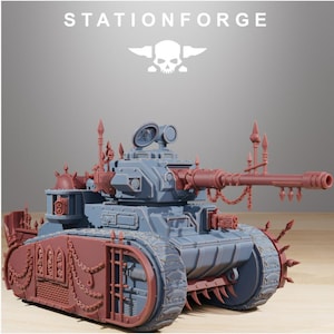 May include: A gray and reddish-brown miniature tank model featuring the text STATIONFORGE at the top. The tank is adorned with spiked details, chains, and a skull emblem. It has a long main cannon, side-mounted weapons, and tracked wheels.