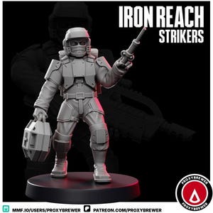May include: A gray miniature figure of a soldier in futuristic armor, holding a weapon and a box-like object. The figure is on a black base, with the words "IRON REACH STRIKERS" in white text above. The Proxybrewer logo is in the bottom right corner.