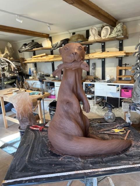 Large Otter with fish Sculpture - view 3 by Kate Cledwyn