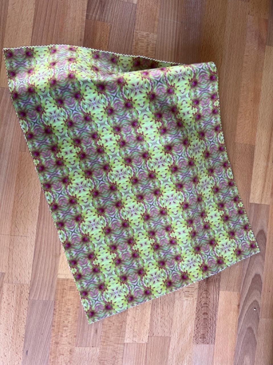 Abstract flower velvet fabric, green and pink floral textile. Bold designer fabric, contemporary luxury material for home decor. Curtaining.