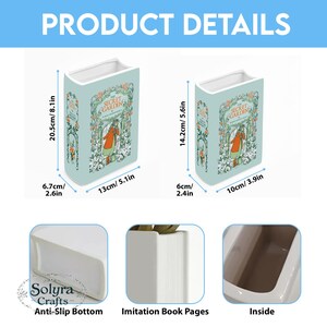 May include: Two ceramic book-shaped vases. The larger vase is 8.1 inches tall, 5.1 inches wide, and 2.6 inches deep. The smaller vase is 5.6 inches tall, 3.9 inches wide, and 2.4 inches deep. Both feature a "Secret Garden" design.
