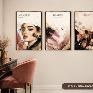 May include: A set of three rectangular wall art prints featuring makeup-themed illustrations. The first print shows a person applying blush with text reading MAKEUP STUDIO. The second shows a profile with text BEAUTY IN EVERY DETAIL. The third shows cosmetics and a rose with text CREATE YOUR SIGNATURE.
