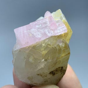 May include: A set of three ceramic mugs with a speckled, matte finish in cream, light grey, and dark grey. Each mug has a simple, minimalist design, suitable for coffee or tea.