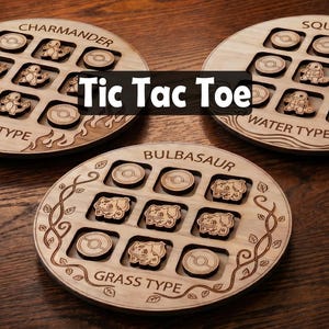 May include: Wooden Tic Tac Toe game boards featuring Pokémon characters. Each board is round and has nine spaces for game pieces. The boards are labeled with the Pokémon types: Fire, Water, and Grass. The game pieces are wooden.