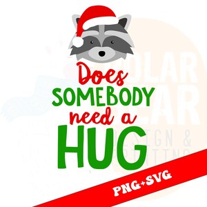May include: A digital graphic featuring a raccoon wearing a Santa hat. The text reads "Does somebody need a HUG" in red and green. A red banner at the bottom says "PNG+SVG".