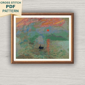 Könnte beinhalten: Ein gerahmtes Kreuzstich-PDF-Muster mit einem Sonnenuntergang über dem Wasser. Das Kunstwerk verwendet Grün-, Blau-, Orange- und Rottöne. Der Text "CROSS STITCH PDF PATTERN" befindet sich in einem Banner oben links. Der Rahmen ist braun.