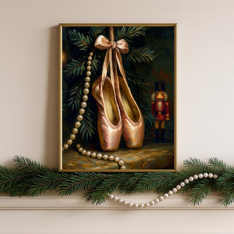 Nutcracker ballet Christmas wall art printable in a light oak frame on a mantel with evergreen garland and warm fairy lights.