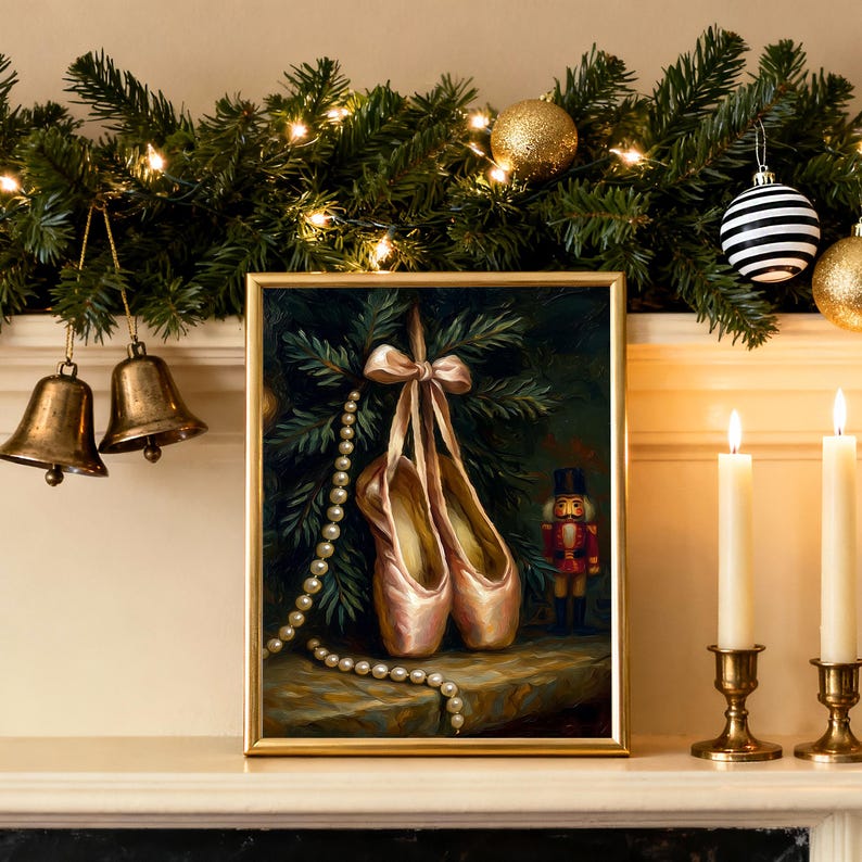 Nutcracker ballet Christmas wall art printable in a light oak frame on a mantel with evergreen garland and warm fairy lights.