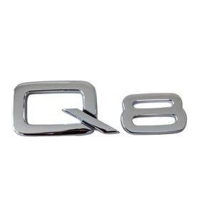Peut inclure: Emblème chromé de voiture avec les lettres "Q8". Le "Q" est une forme carrée avec une ligne diagonale, et le "8" est un chiffre arrondi. L'emblème est conçu pour une utilisation automobile.