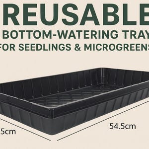May include: A black, rectangular bottom-watering tray for seedlings and microgreens. The tray is 28.5 cm wide and 54.5 cm long. The text "REUSABLE BOTTOM-WATERING TRAY FOR SEEDLINGS & MICROGREENS" is printed above the tray.