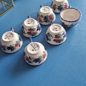 7 small HB Quimper cups, polychrome glazed earthenware, 5.5cm high, 3.5cm diameter