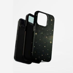 May include: Three black phone cases. One case is plain black, while the other two have a dark green and gold starry night design. The cases are designed to protect the phone.