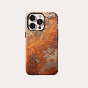 May include: A smartphone case with a textured, weathered appearance. The case features a pattern of rust-colored and gray tones, resembling aged stone or metal. The camera lens is visible at the top.