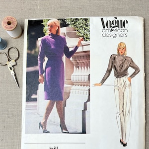 May include: Vogue American Designers sewing pattern for a dress and a blouse by Bill Kaiserman. The pattern number is 2597.