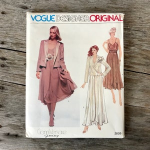 May include: A vintage Vogue Designer Original sewing pattern for a dress and jacket by Gianni Versace. The pattern number is 2026.