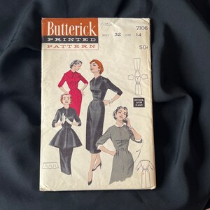 May include: Vintage sewing pattern for a dress, featuring three women wearing different styles of dresses. The pattern is from Butterick, size 14, bust 32, and is labeled "Printed Pattern".