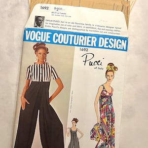 May include: Vogue Couturier Design pattern 1692 by Emilio Pucci of Italy. The pattern features two designs: a black and white striped jumpsuit with wide-legged pants and a colorful maxi dress with a geometric pattern.