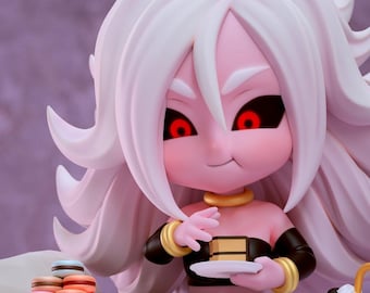 May include: A figurine of a character with pink skin, white hair, and red eyes, holding a small plate with a piece of cake. The character is wearing a black and gold outfit and is surrounded by colorful macarons and a blue cup.