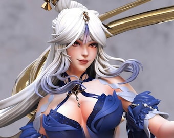 May include: A detailed figurine of a woman with long white hair and red eyes. She wears a blue dress with ornate details and gold accents. The figurine has a serene expression and is well-lit, showcasing intricate design.