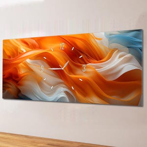 May include: A rectangular wall clock with an abstract design. The artwork features flowing orange, white, and blue colours, resembling fabric or smoke. The clock hands and numerals are white.