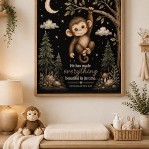 May include: A framed wall art print featuring a cartoon monkey hanging from a tree branch against a black night sky with a crescent moon, stars, and clouds. The text reads: He has made everything beautiful in its time. ECCLESIASTES 3:11.