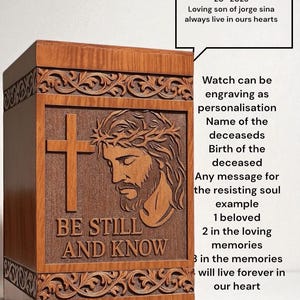 Side angle of handcrafted wooden memorial urn with floral carved border and elegant grain pattern. This religious cremation urn combines faith-inspired art and high-quality wood craftsmanship. Ideal for families seeking a personalized, faith-based urn for adult ashes. Timeless design suits any memorial space or home décor.