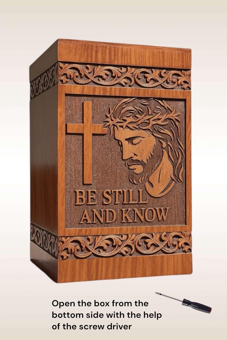 Personalized wooden urn box with engraved name, birth and passing dates, and short message under the quote “Be Still and Know.” Customizable Christian urn with cross and Jesus design, handmade with care for a unique and heartfelt tribute. Laser engraving adds a personal, lasting touch for your loved one’s memory.