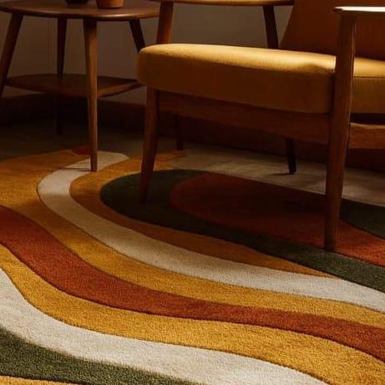 May include: A retro-style area rug with a wavy, striped pattern in shades of green, white, yellow, orange, and brown. The rug is placed under a mid-century modern chair and side table, creating a warm and inviting space.