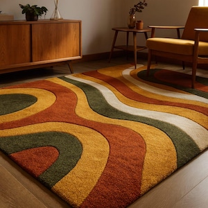 May include: A retro-style area rug with a wavy pattern in shades of orange, yellow, green, and white. The rug's design evokes a 1970s aesthetic, adding a vibrant touch to any living space. The rug is a rectangular shape.
