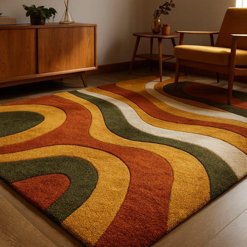 May include: A retro-style area rug with a wavy pattern in shades of orange, yellow, green, and white. The rug's design evokes a 1970s aesthetic, adding a vibrant touch to any living space. The rug is a rectangular shape.