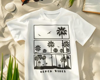 May include: A white short-sleeved t-shirt featuring a black graphic print of palm trees, birds, and two small figures in three stacked rectangular frames. The text "BEACH VIBES" is printed in black capital letters below the graphic design.