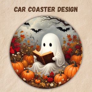 May include: A round car coaster design featuring a white ghost reading an open brown book, surrounded by orange pumpkins, red and orange autumn leaves, and black bats flying in a cloudy sky. The text CAR COASTER DESIGN is printed above.