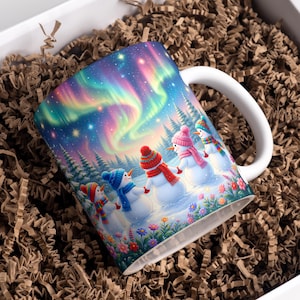 May include: A white ceramic mug featuring a colorful illustration of four snowmen wearing hats and scarves, holding hands in a snowy landscape under a vibrant aurora borealis sky with pine trees and small flowers in the foreground.
