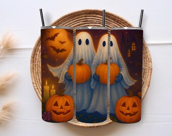 May include: Three Halloween-themed tumblers with black straws, featuring a spooky design. The artwork depicts ghosts holding pumpkins, bats, and a full moon. The tumblers are set against a woven background, perfect for seasonal drinks.