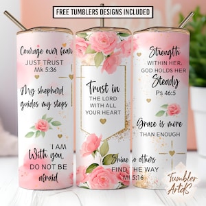 May include: Three cylindrical tumblers with metal straws, featuring a white and pink watercolor background with pink roses, gold glitter accents, and religious text including Courage over fear, Trust in the Lord, and Strength within her.