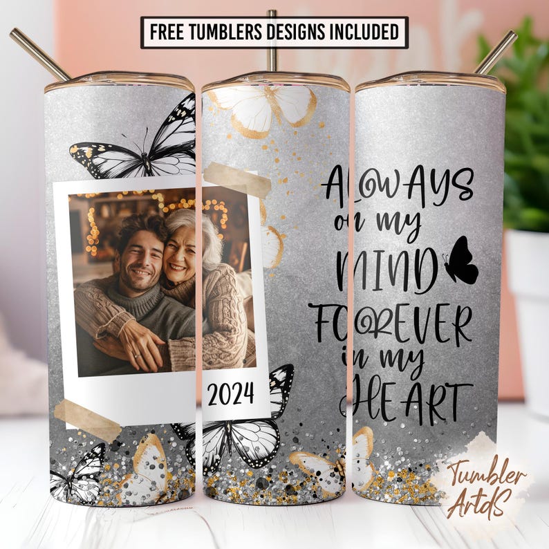 May include: A personalized tumbler with a photo, butterflies, and the text "Always on my mind, forever in my heart." The design includes gold accents and the year 2024. The tumbler has a silver background and a straw.