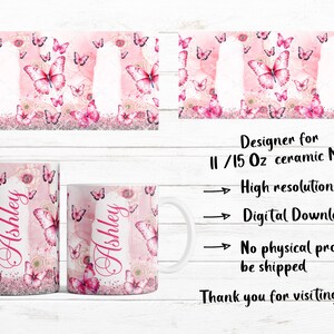 May include: Pink ceramic mug with a butterfly and floral design, personalized with the name "Ashley" in a cursive font. The mug has a white handle and a matching design on the front and back. The background features butterflies and flowers.