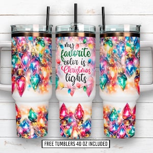 May include: Three 40 oz tumblers with a colorful Christmas lights design. The tumblers feature a white base and a copper-colored rim. The center tumbler has the text "my favorite color is Christmas lights".