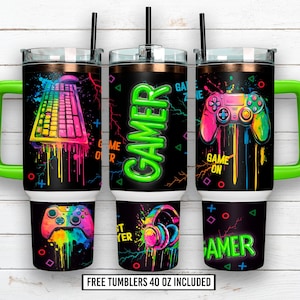 May include: Three 40 oz tumblers with black backgrounds and neon gamer-themed graphics. One features a keyboard, another a controller, and the third a headset. Each has a green handle and a black straw.