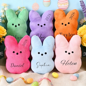 May include: A white ceramic mug with a black handle and the text "But First, Coffee" in a handwritten style. The mug is on a white surface. The mug is approximately 4 inches tall.