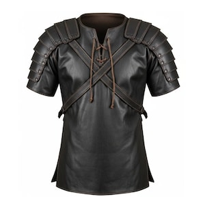 May include: A dark brown leather tunic with attached shoulder armour. The short-sleeved garment features a laced neckline and cross-body straps. The shoulder armour is made of layered plates. The tunic has a medieval or fantasy theme.