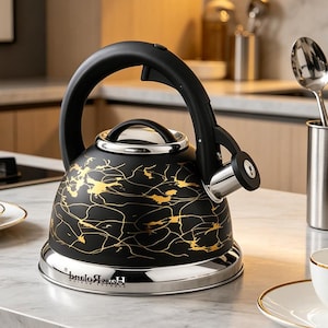 May include: Black and gold patterned stovetop kettle with a stainless steel base and spout. The kettle has a black handle and a silver rim. The design features a gold splatter pattern on a black background. The kettle is designed for stovetop use.