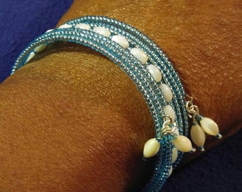Pale blue seed beads and white mother of pearl memory wire wrap cuff bracelet. FREE SHIPPING!