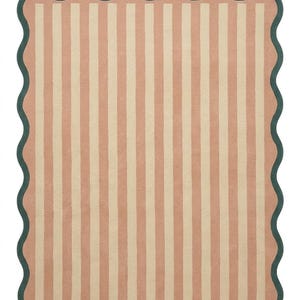 May include: A rectangular area rug featuring a pattern of vertical stripes in alternating shades of muted peach and cream. The rug is finished with a dark forest green scalloped border that follows the wavy edge of the entire piece.